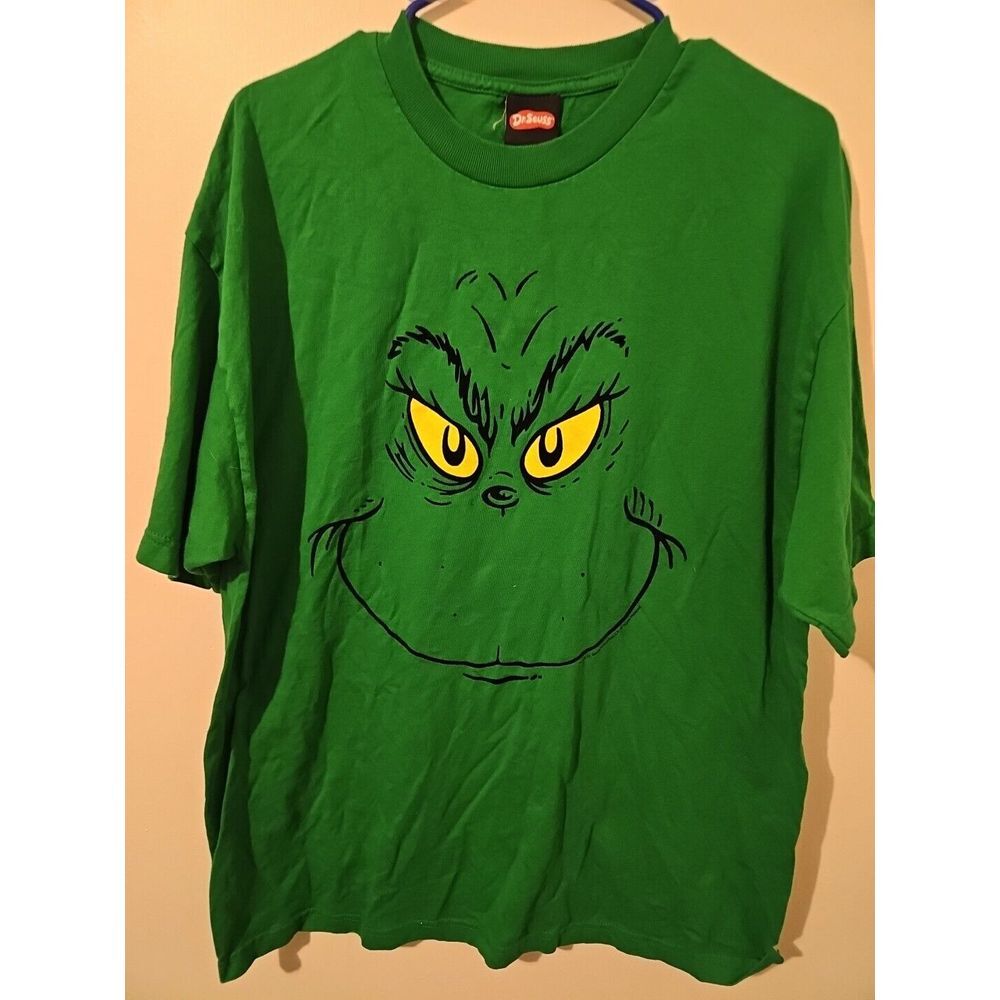 Vintage 2001 The Grinch Big Face AOP t-shirt on a Dr. Seuss tag size XL